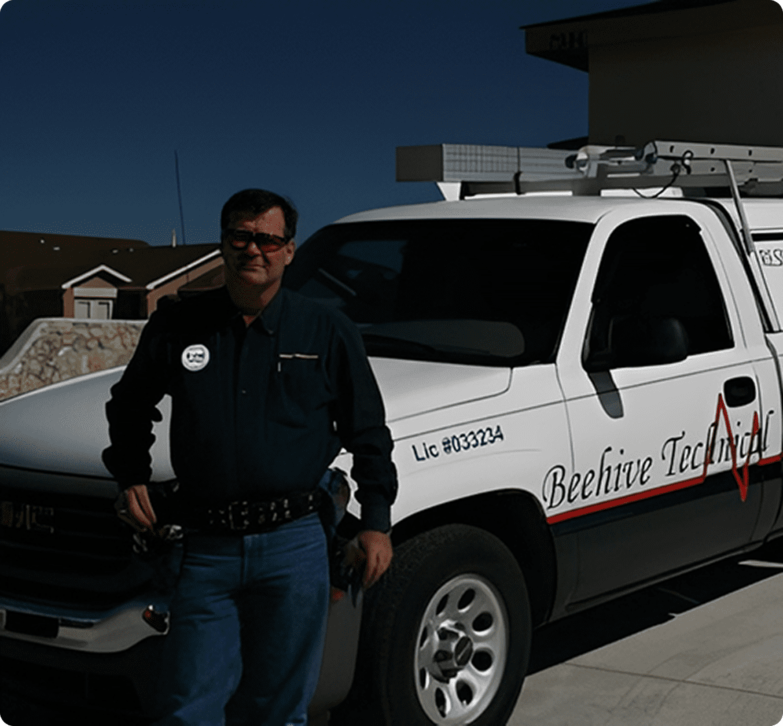 Technician next to company vehicle